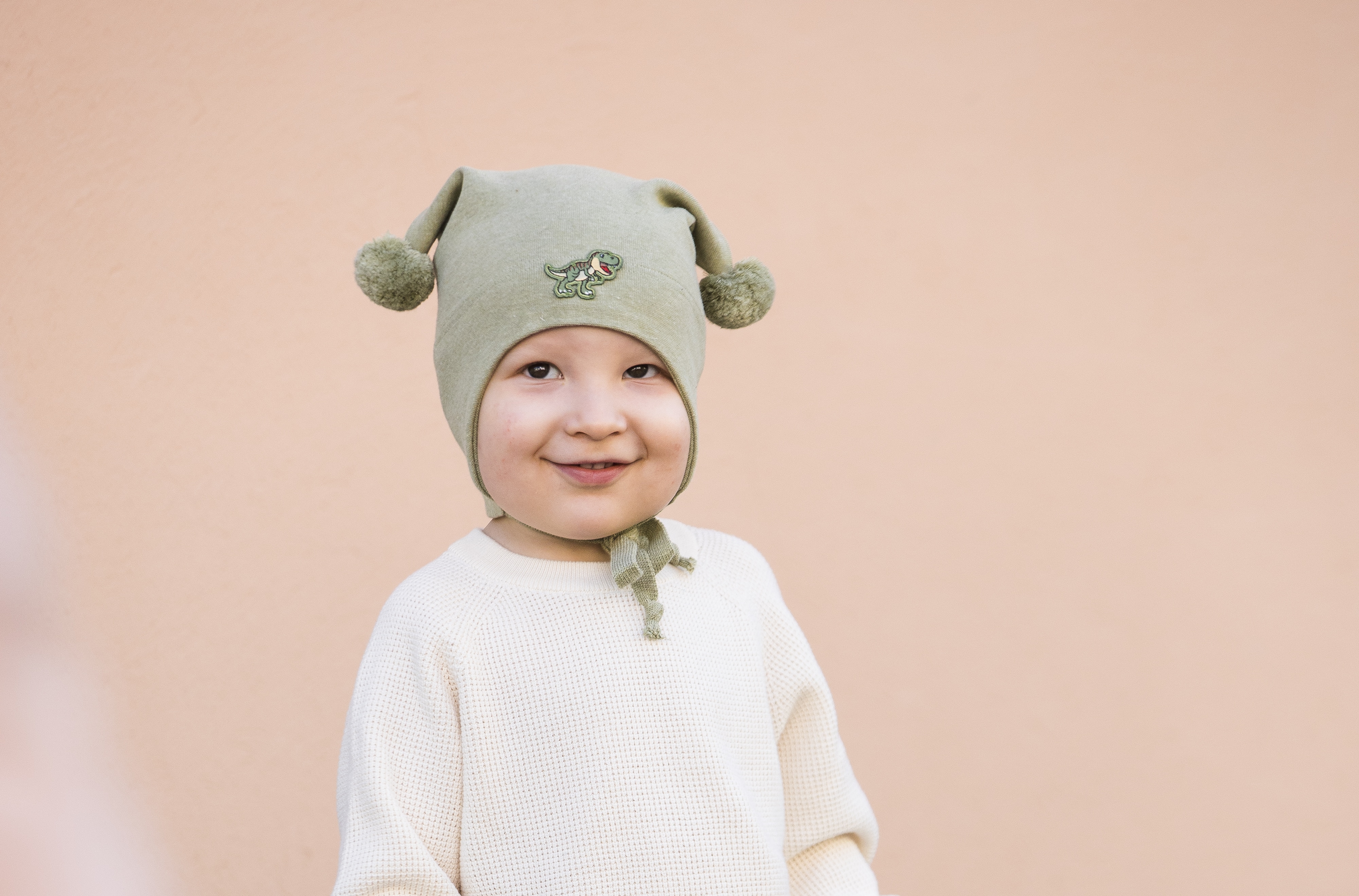 Kivat Knytelue med Dinosaur Olivengrønn